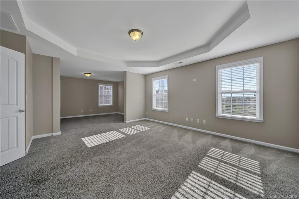264 Annatto Way Tega Cay, SC 29708 - Photo 22 of 36 a view of an empty room with a window