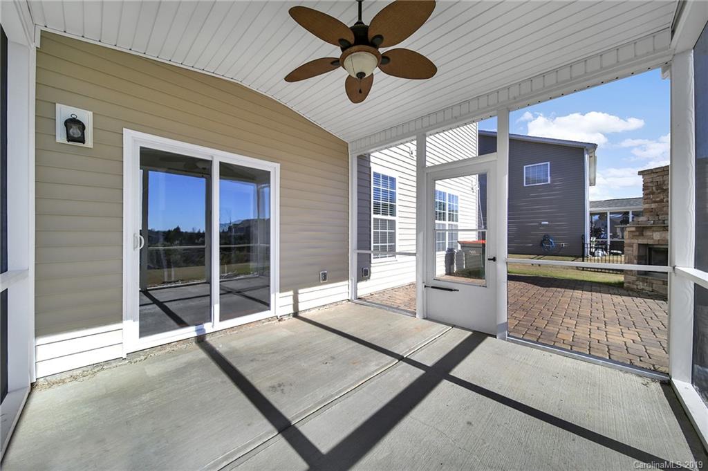 264 Annatto Way Tega Cay, SC 29708 - Photo 34 of 36 a living room with hardwood floor and a large window