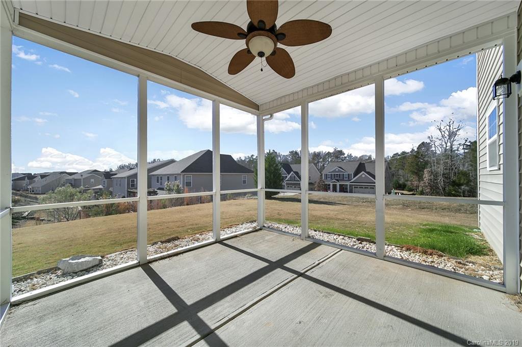 264 Annatto Way Tega Cay, SC 29708 - Photo 35 of 36 a view of swimming pool with a bench and floor to ceiling window