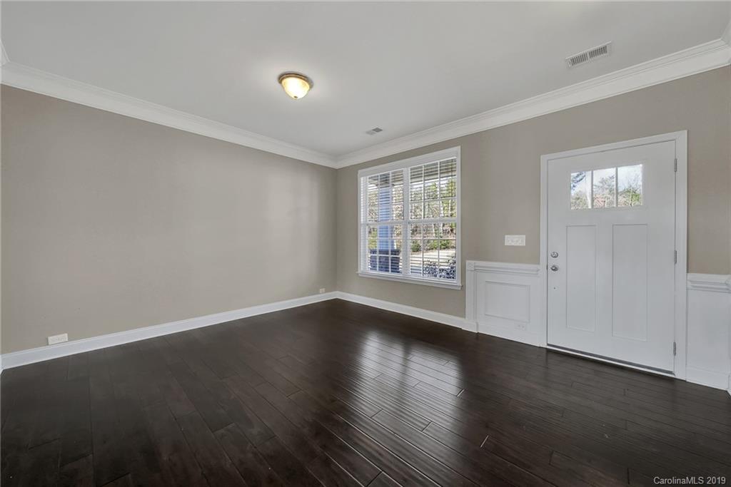 264 Annatto Way Tega Cay, SC 29708 - Photo 5 of 36 a view of a livingroom with wooden floor and window