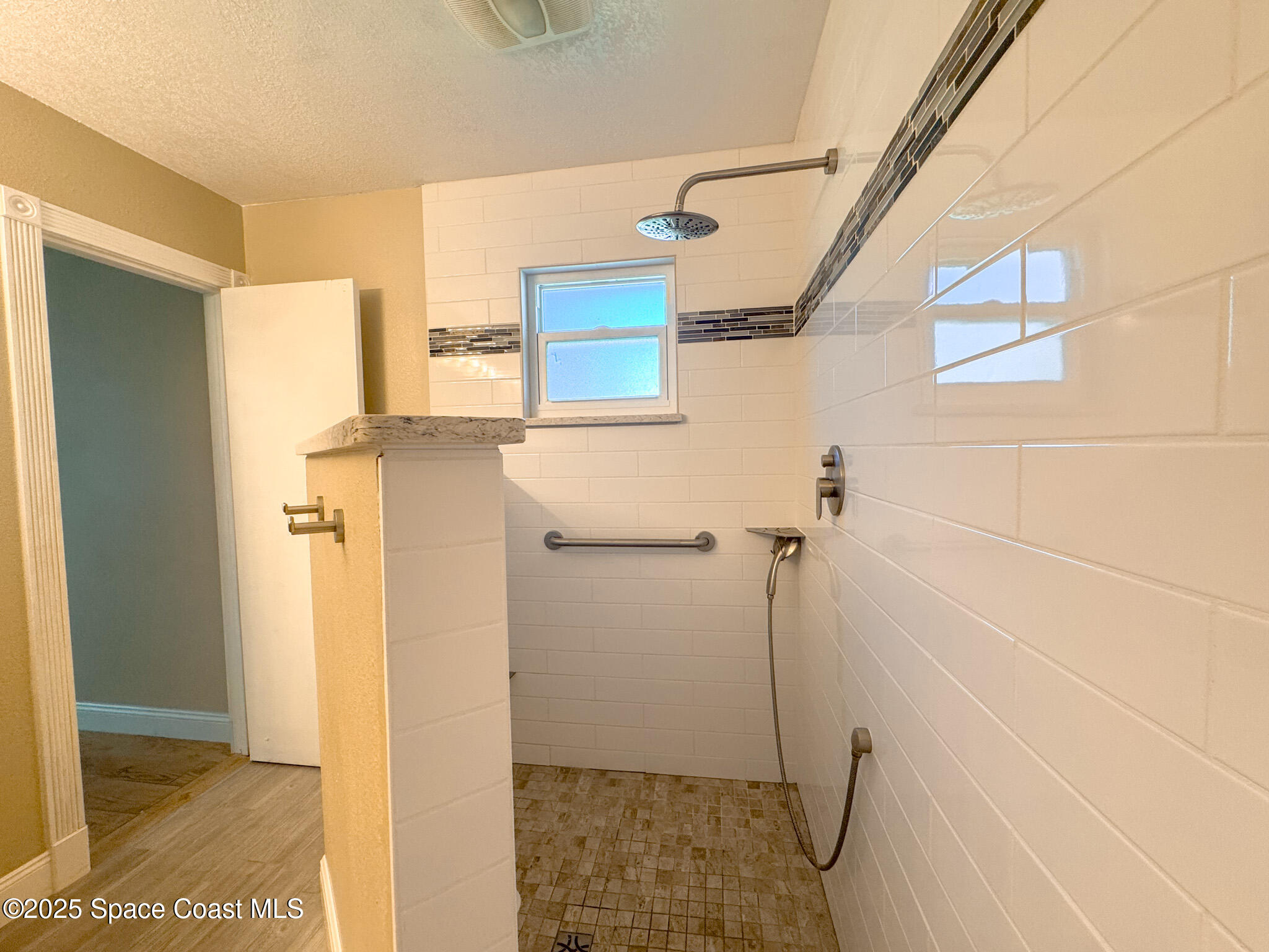 871 Southern Pine Trail Rockledge, FL 32955 - Photo 18 of 36 a bathroom with a shower