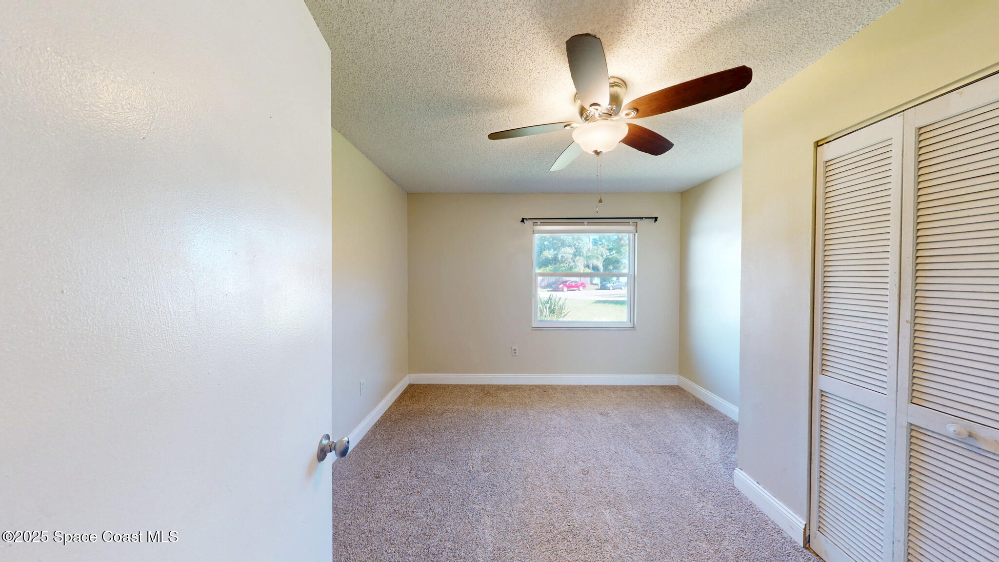 871 Southern Pine Trail Rockledge, FL 32955 - Photo 19 of 36 a view of an empty room with a window