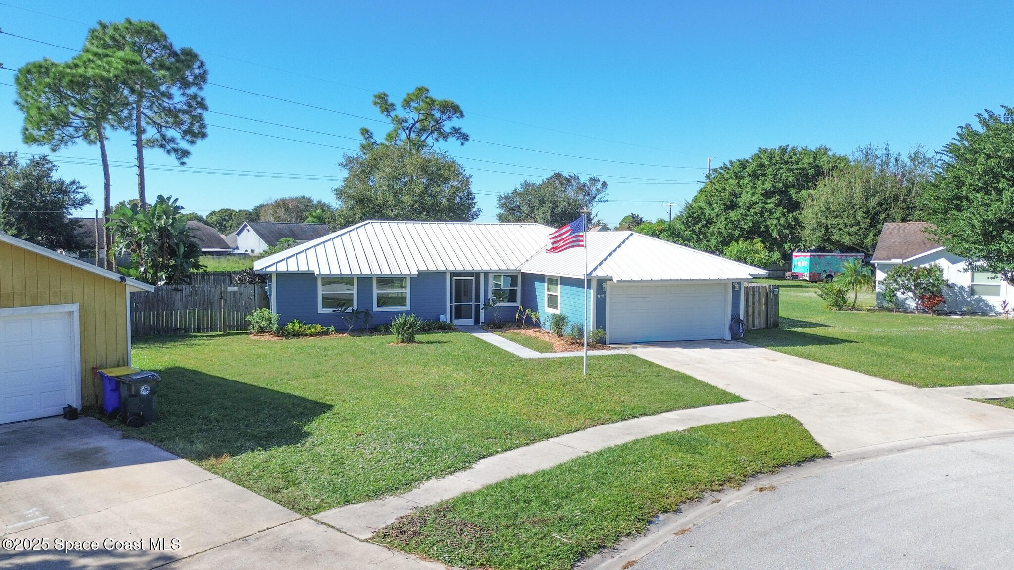 871 Southern Pine Trail Rockledge, FL 32955 - Photo 2 of 36 a front view of a house with garden