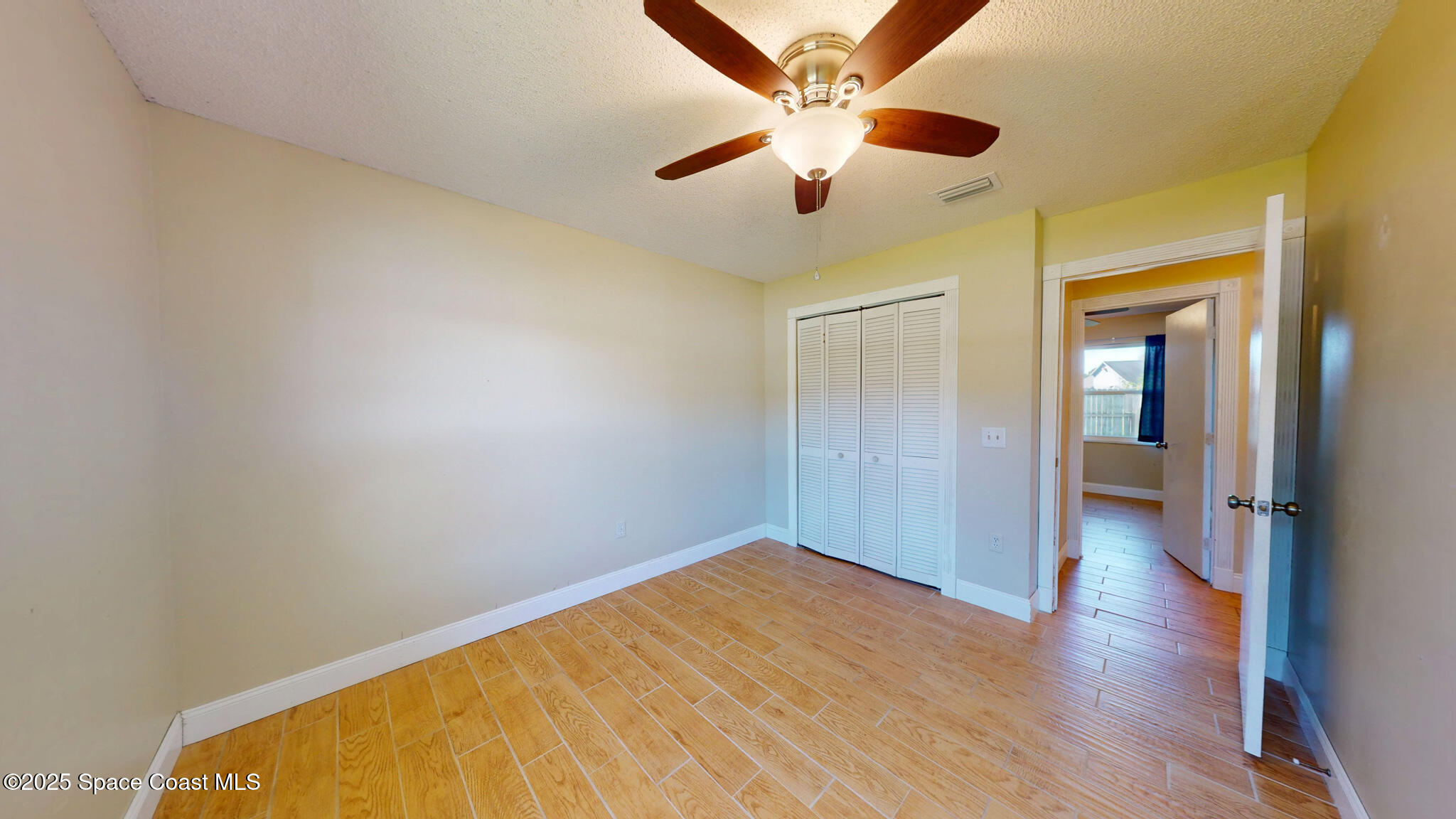 871 Southern Pine Trail Rockledge, FL 32955 - Photo 25 of 37 wooden floor in an empty room
