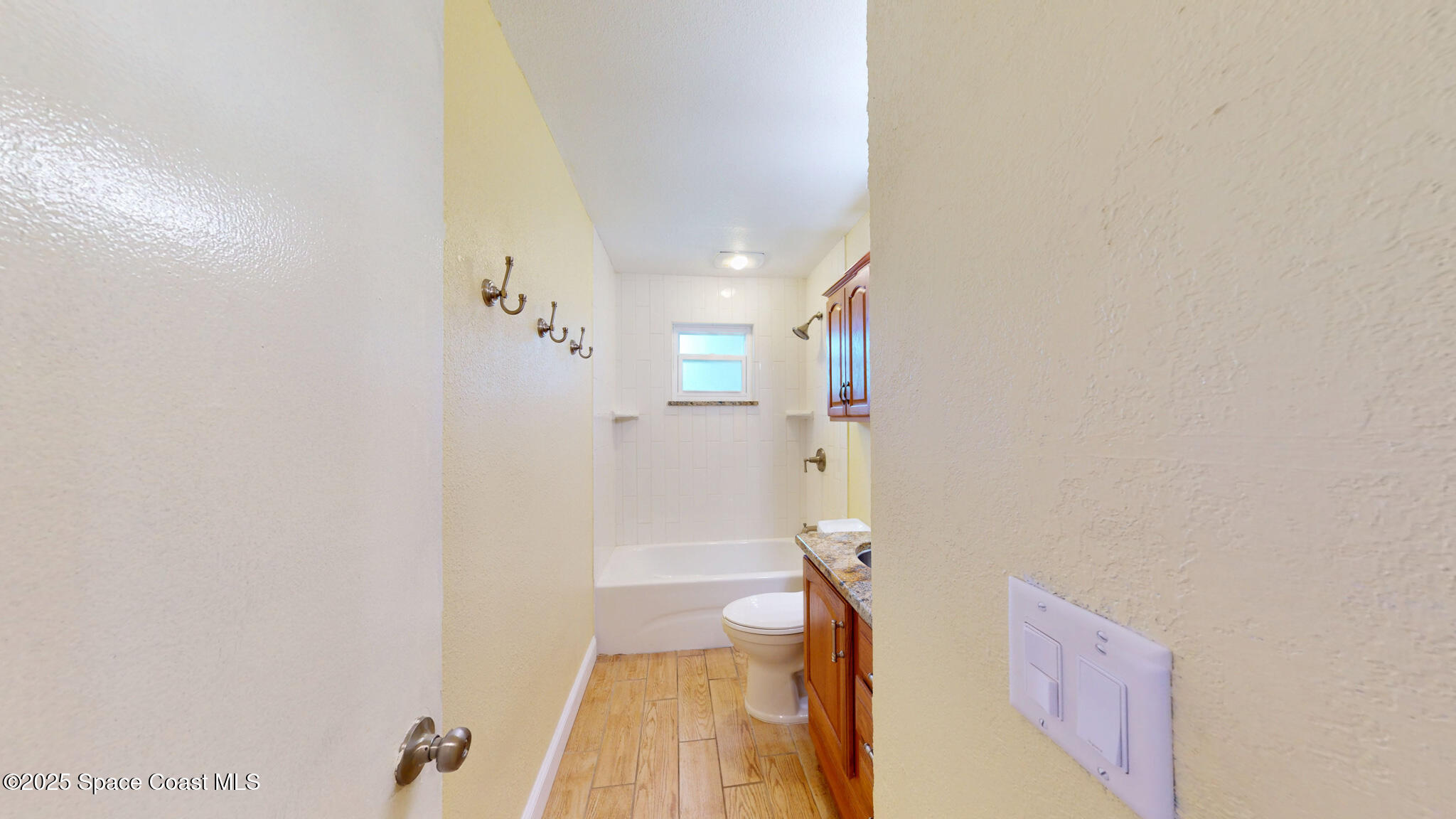 871 Southern Pine Trail Rockledge, FL 32955 - Photo 28 of 36 a bathroom with a bathtub and a shower
