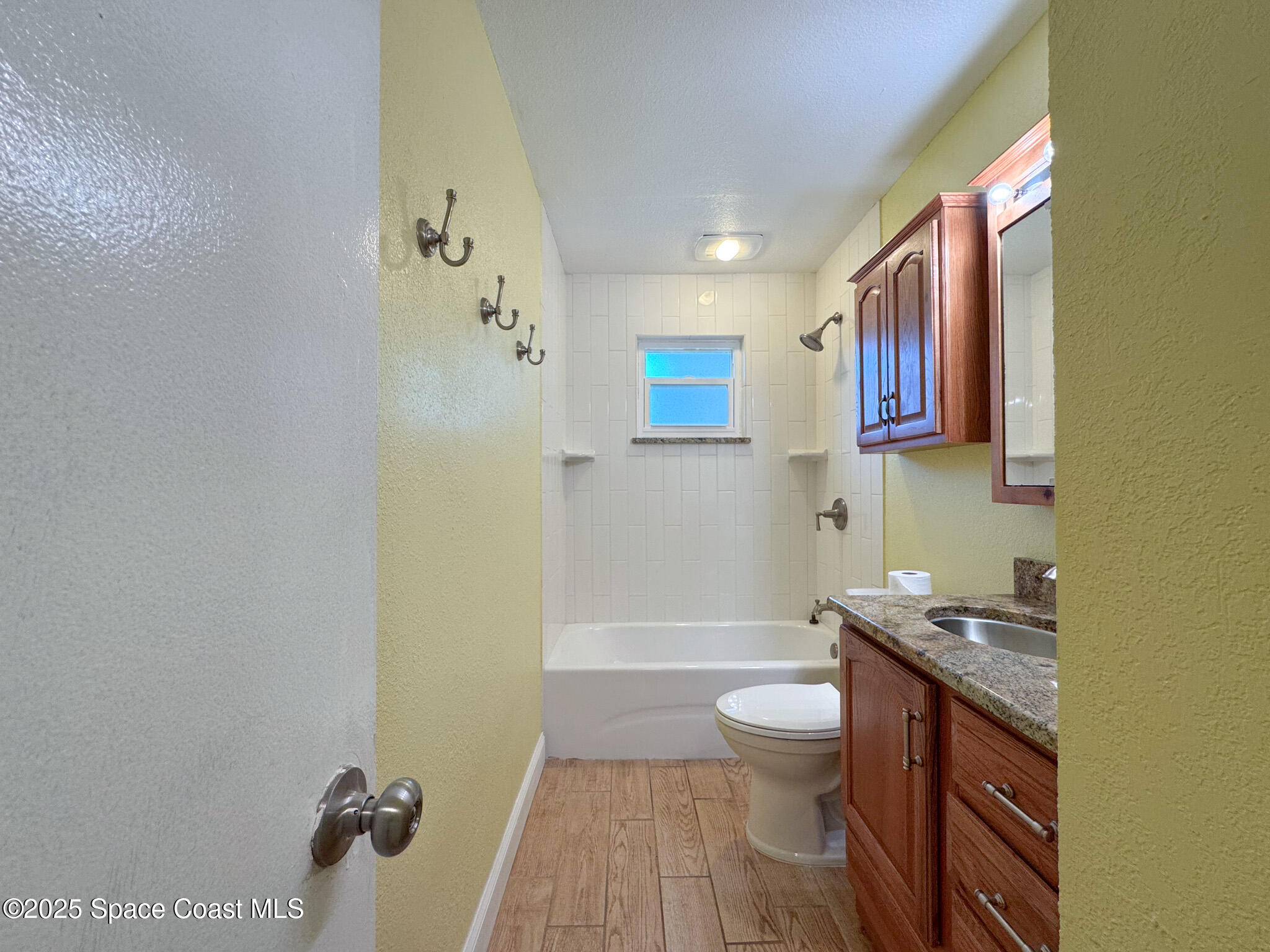 871 Southern Pine Trail Rockledge, FL 32955 - Photo 29 of 36 a bathroom with a granite countertop sink toilet and shower