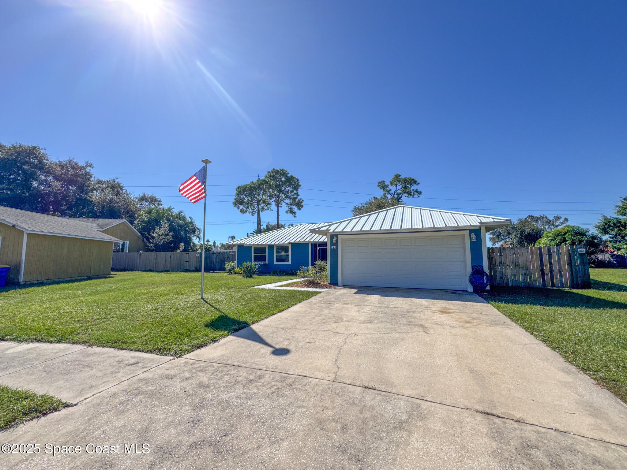 871 Southern Pine Trail Rockledge, FL 32955 - Photo 3 of 36 a front view of a house with a yard and garage