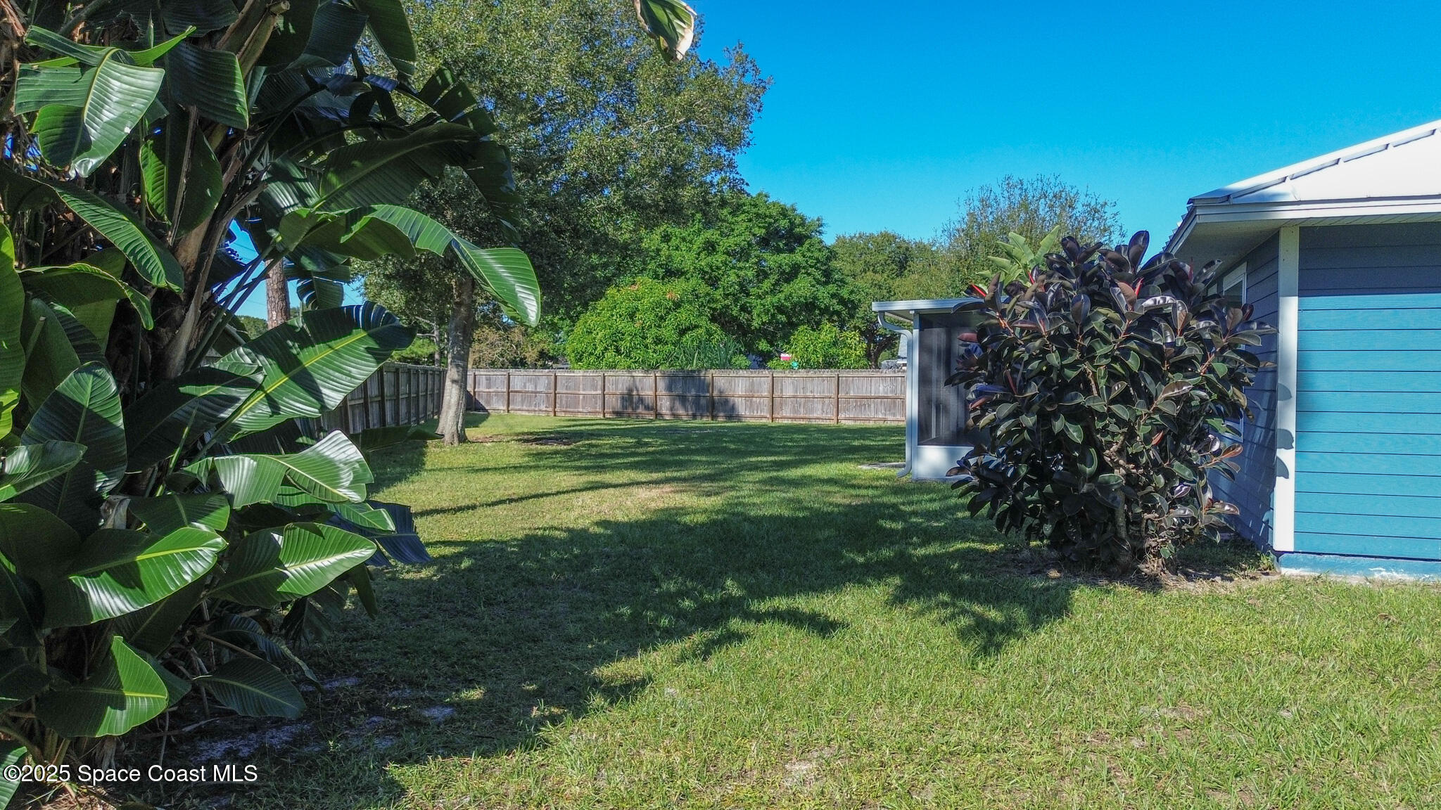 871 Southern Pine Trail Rockledge, FL 32955 - Photo 34 of 36 a view of a backyard with garden