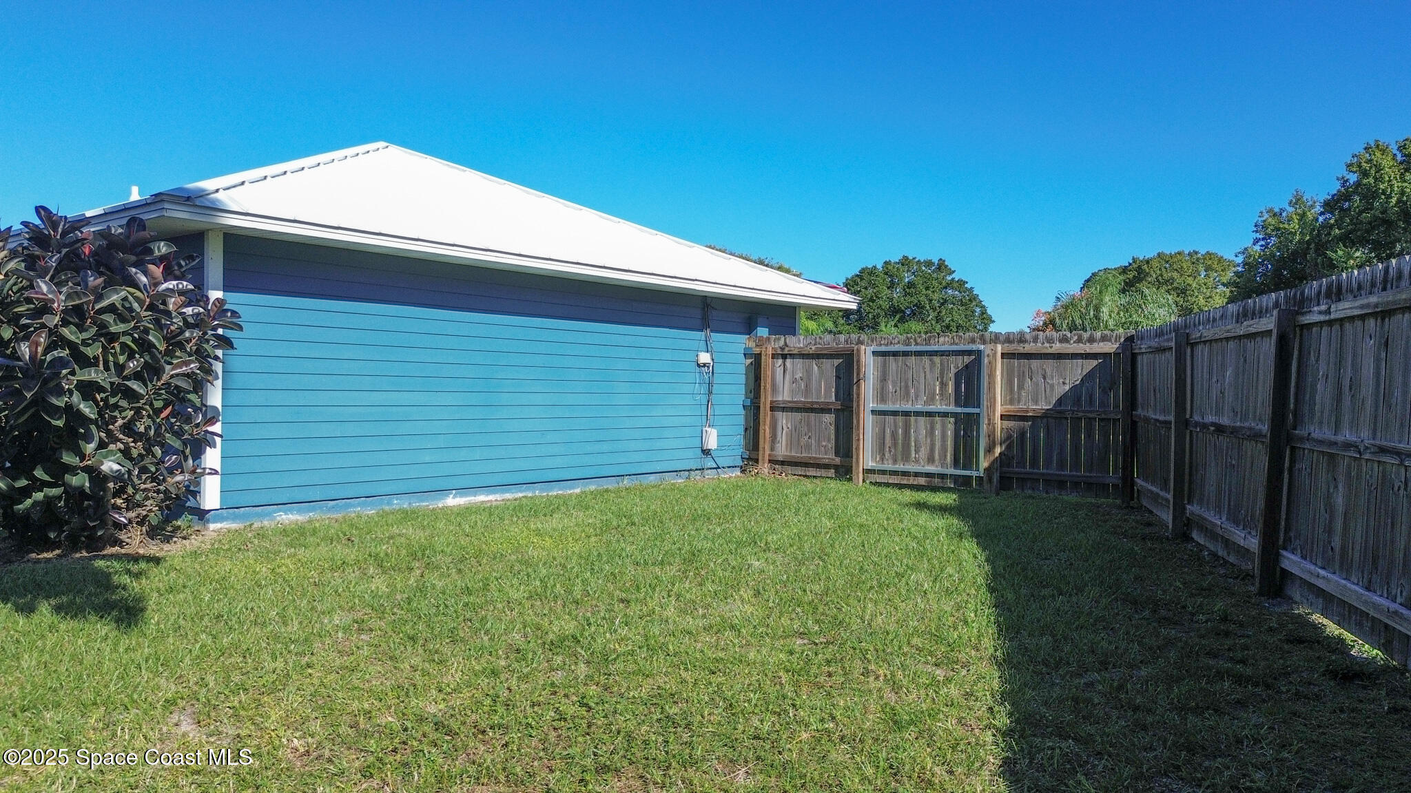 871 Southern Pine Trail Rockledge, FL 32955 - Photo 36 of 37 a view of backyard with small cabin