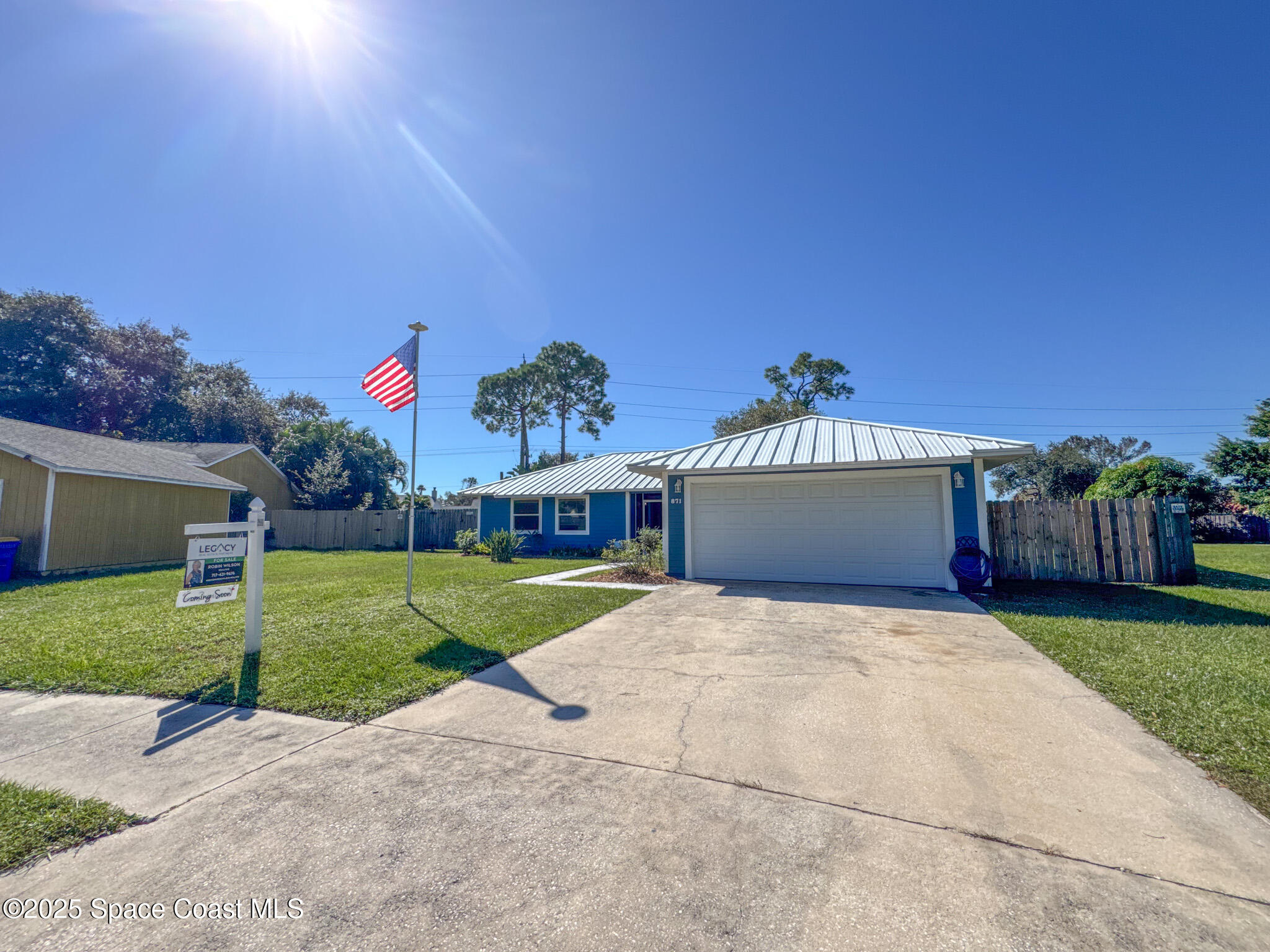 871 Southern Pine Trail Rockledge, FL 32955 - Photo 4 of 37 a front view of a house with a yard and garage