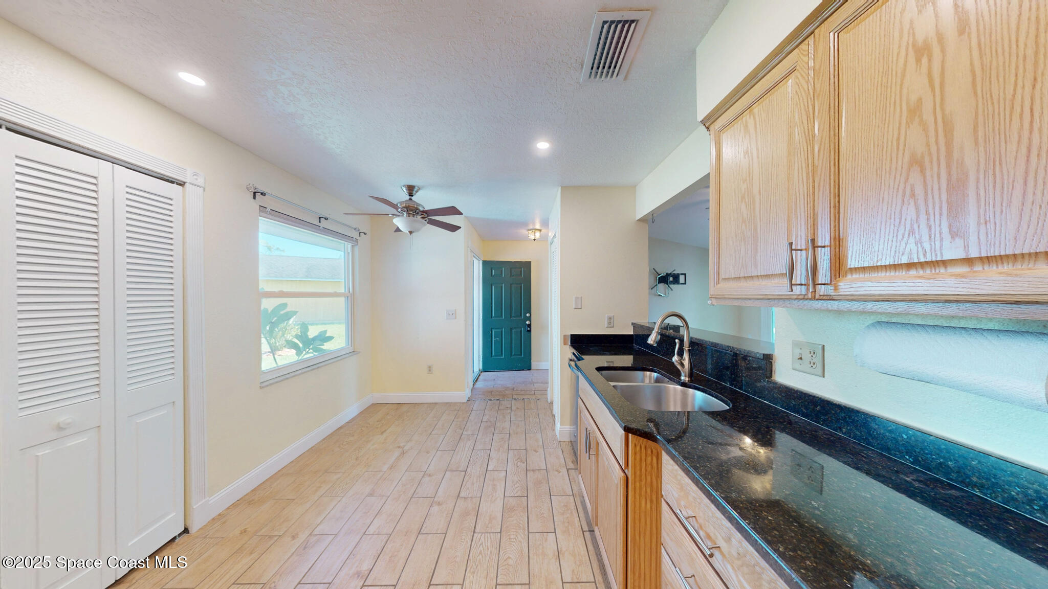 871 Southern Pine Trail Rockledge, FL 32955 - Photo 9 of 37 a kitchen with a sink appliances cabinets and a window