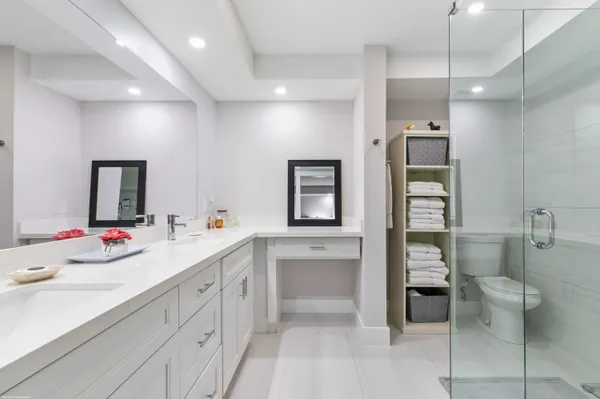 a view of bathroom with dual sinks