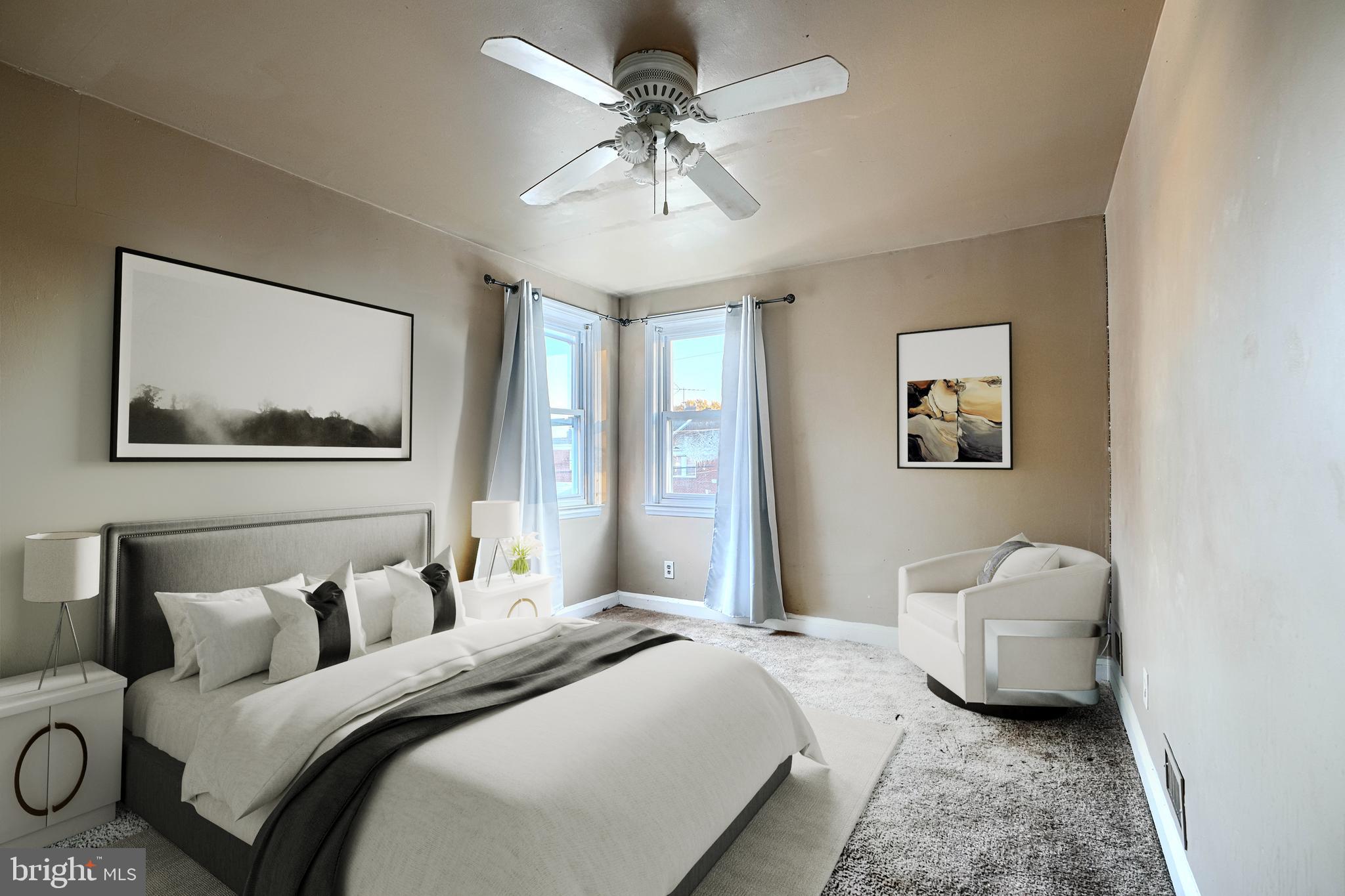 1517 Medford Road Baltimore, MD 21218 - Photo 17 of 27 a bedroom with bed couch and window