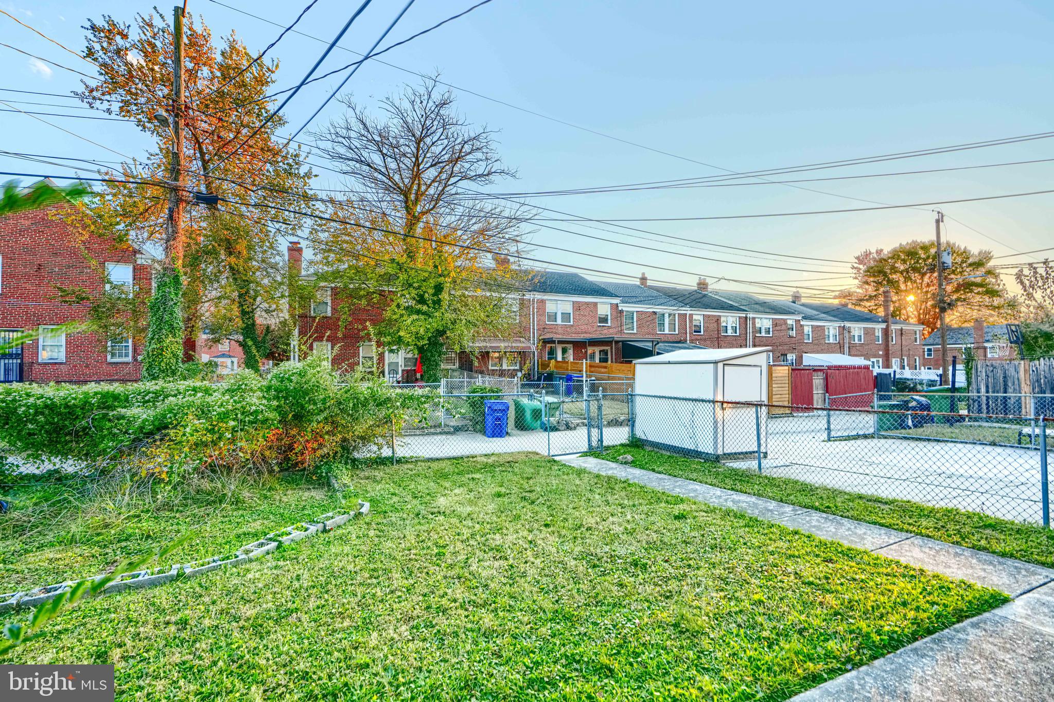 1517 Medford Road Baltimore, MD 21218 - Photo 23 of 27 a house with lots of trees in front of it