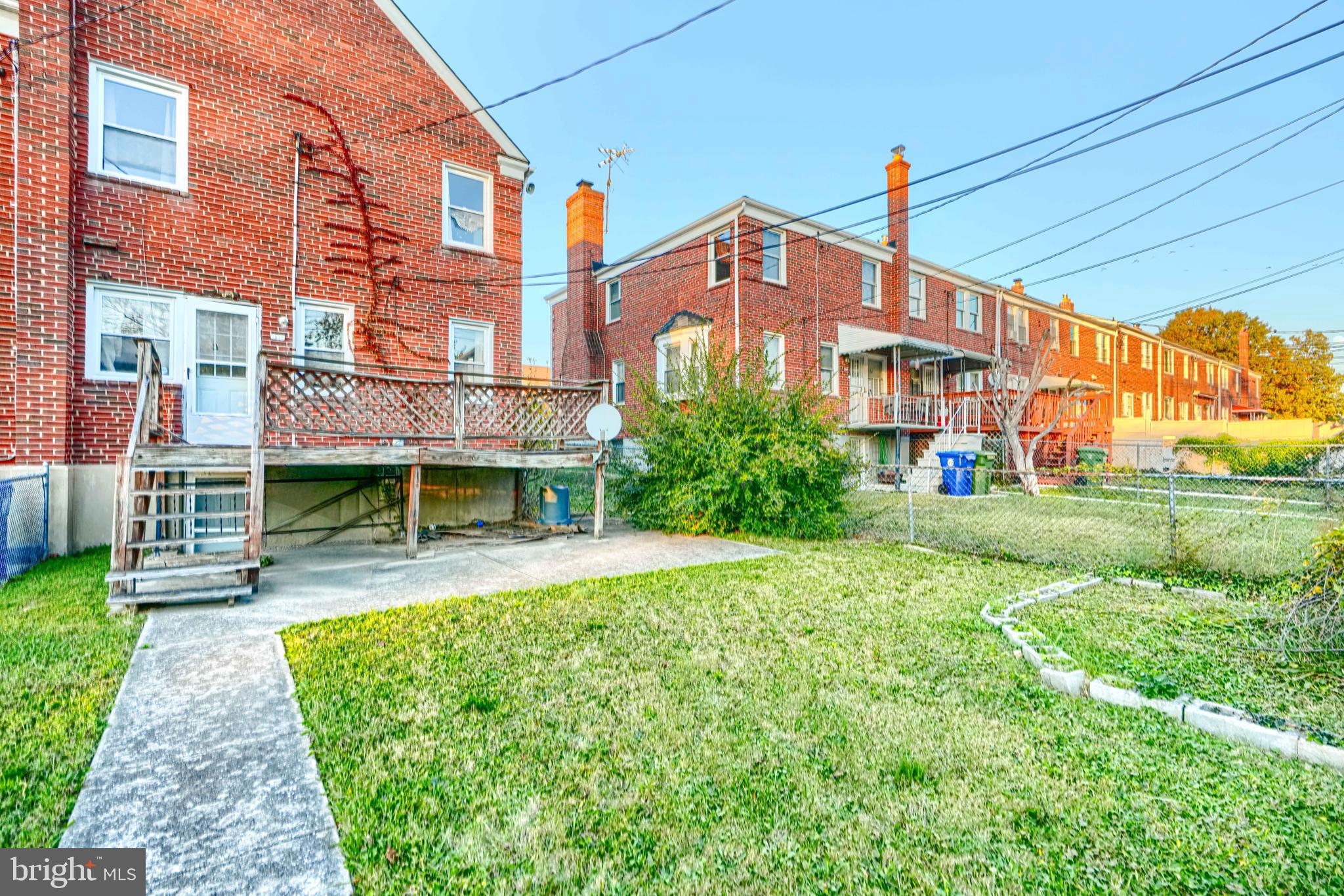 1517 Medford Road Baltimore, MD 21218 - Photo 24 of 27 a front view of a building with a garden