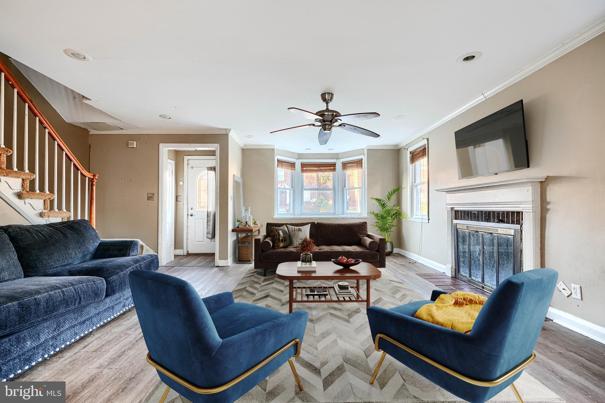 1517 Medford Road Baltimore, MD 21218 - Photo 6 of 27 a living room with furniture and a fireplace