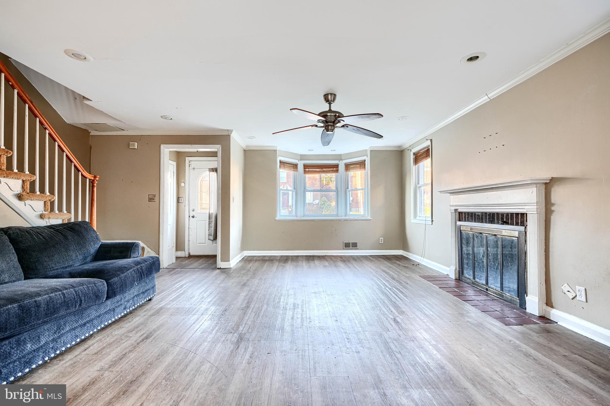 1517 Medford Road Baltimore, MD 21218 - Photo 7 of 27 a view of livingroom with furniture wooden floor and windows