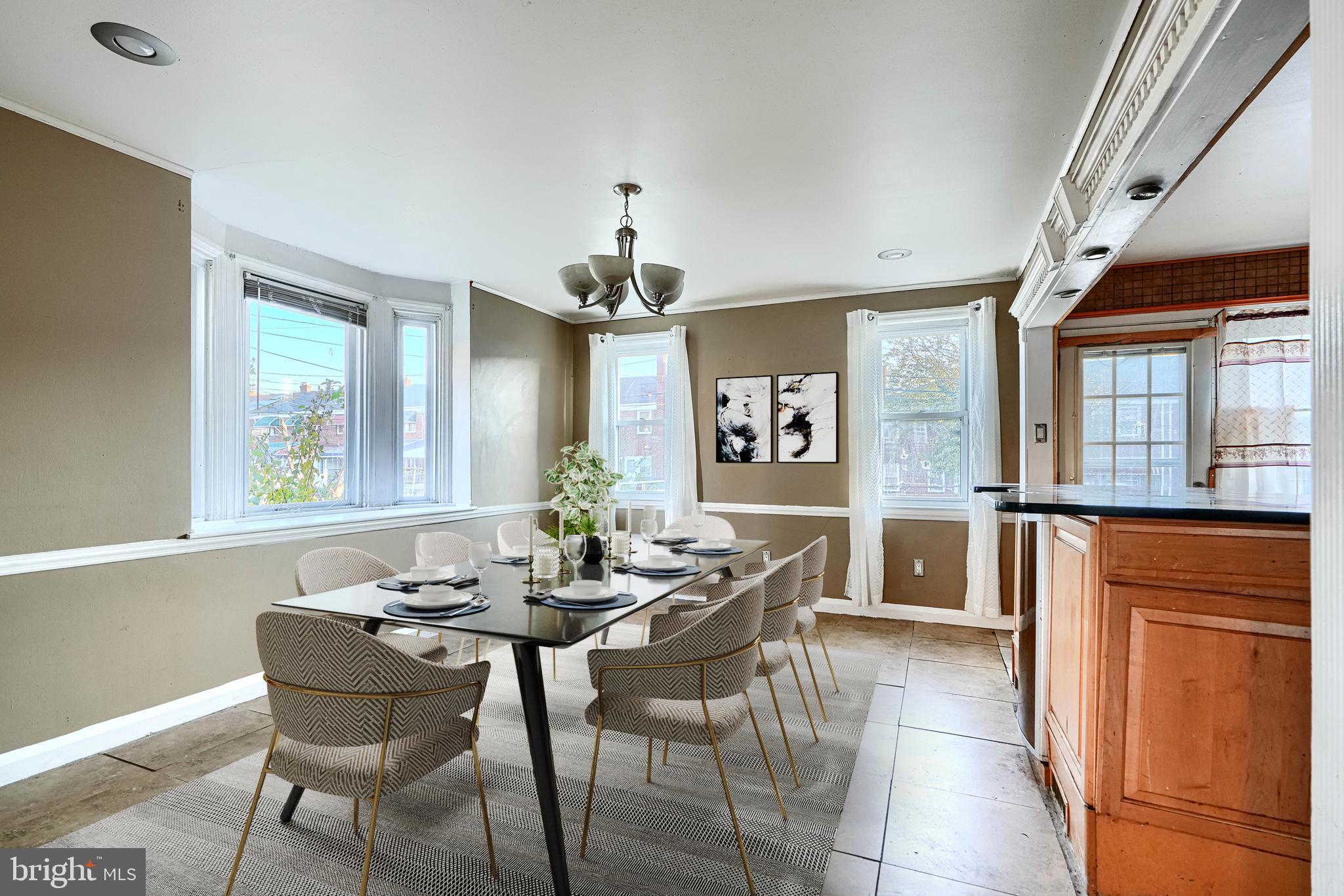 1517 Medford Road Baltimore, MD 21218 - Photo 8 of 27 a dining room with furniture and window