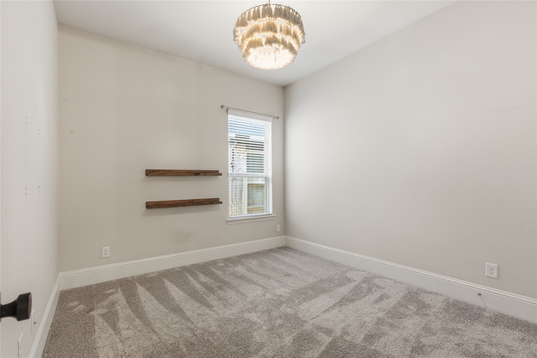 633 Ashbrook Ridge Lane Pinehurst, TX 77362 - Photo 23 of 35 a view of an empty room with a window