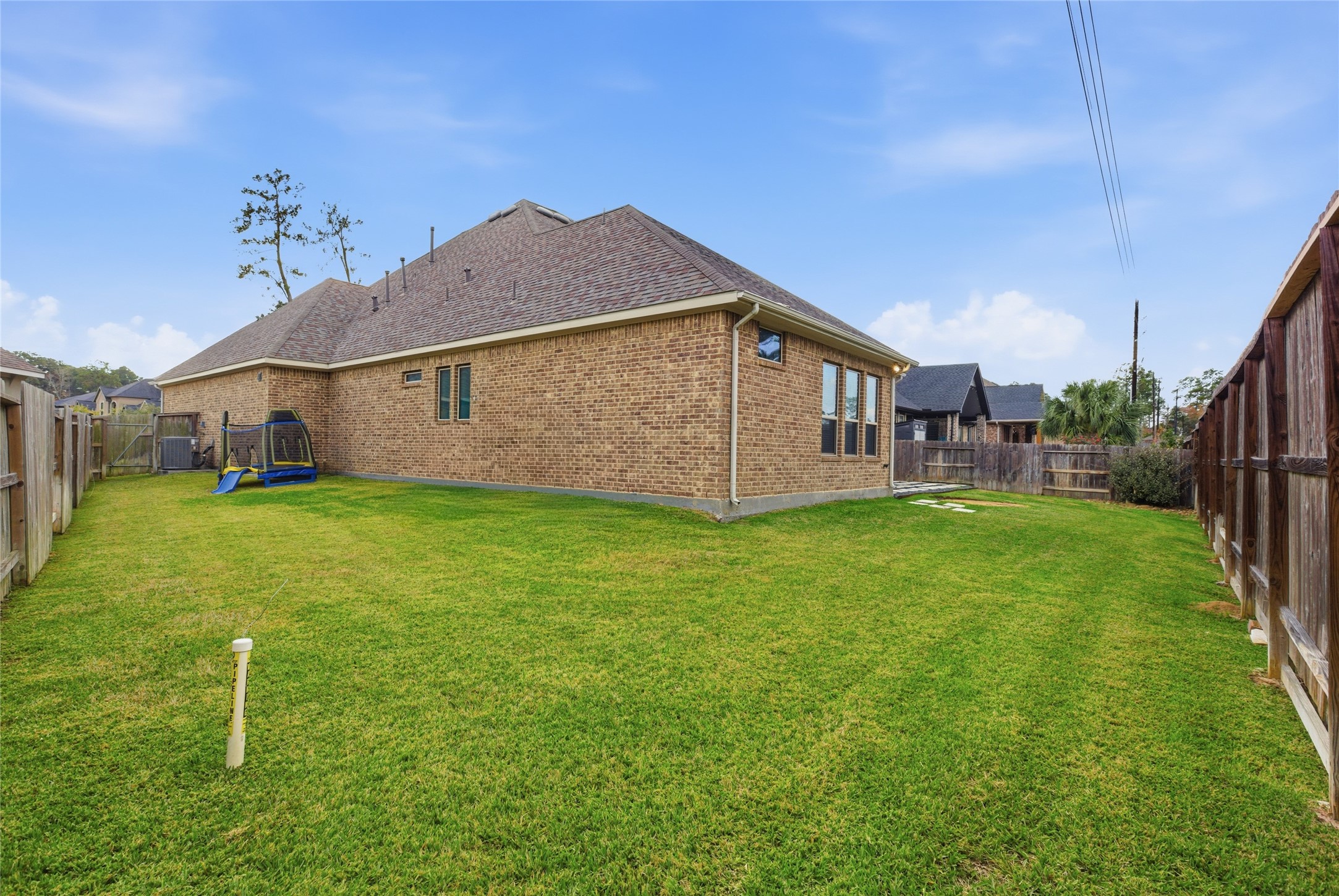 633 Ashbrook Ridge Lane Pinehurst, TX 77362 - Photo 28 of 35 a view of a house with a yard
