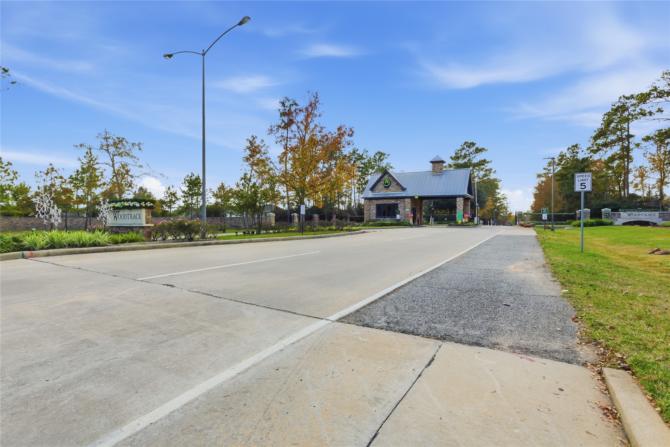 633 Ashbrook Ridge Lane Pinehurst, TX 77362 - Photo 32 of 35 a view of a house with a yard and plants