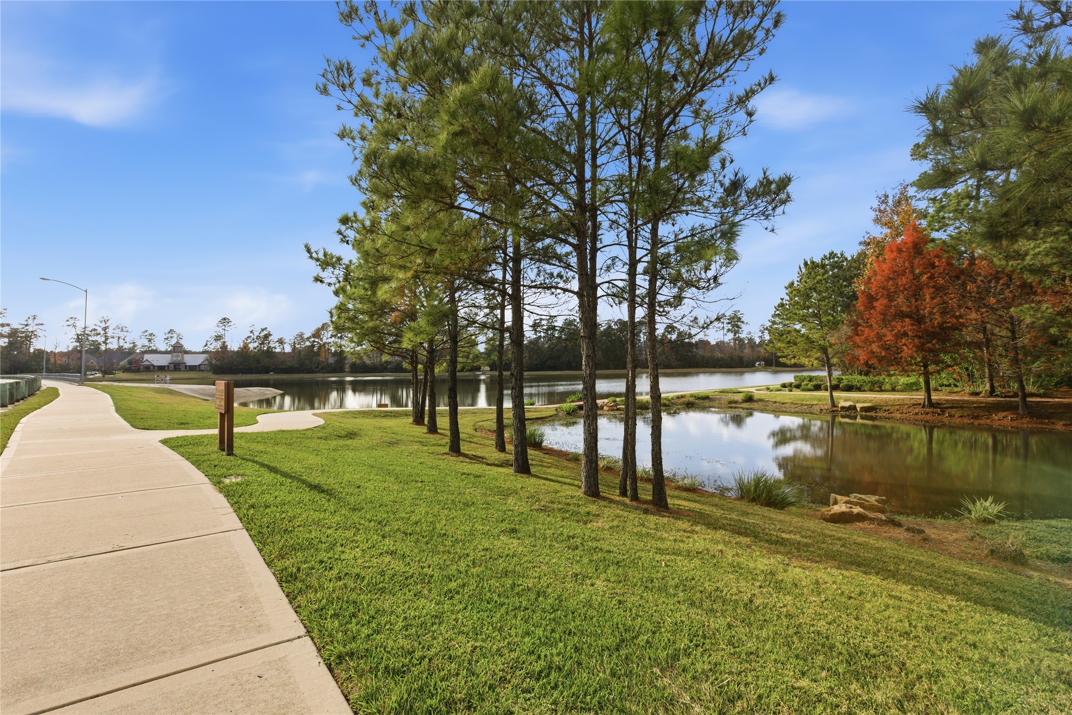 633 Ashbrook Ridge Lane Pinehurst, TX 77362 - Photo 33 of 35 a view of a lake with a large trees
