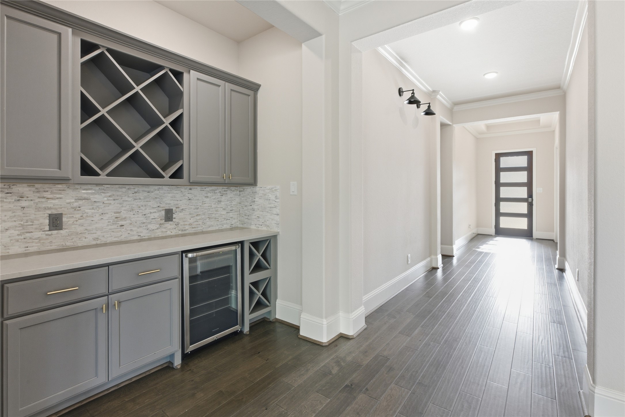 633 Ashbrook Ridge Lane Pinehurst, TX 77362 - Photo 5 of 35 a view of room with wooden floor and cabinet