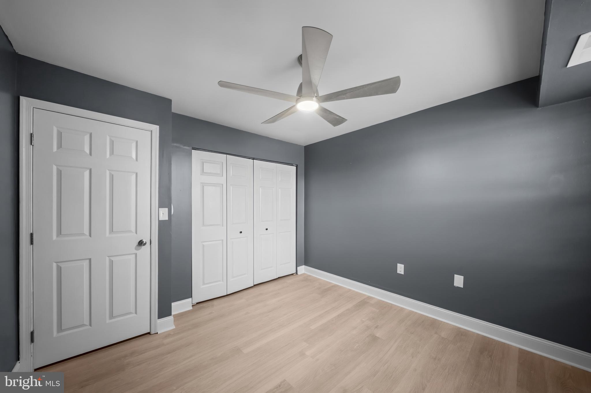 2 Mountbatten Court Baltimore, MD 21207 - Photo 5 of 13 an empty room with a ceiling fan and a window