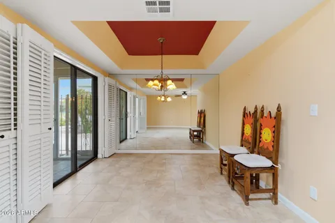 a view of a livingroom with furniture and a chandelier