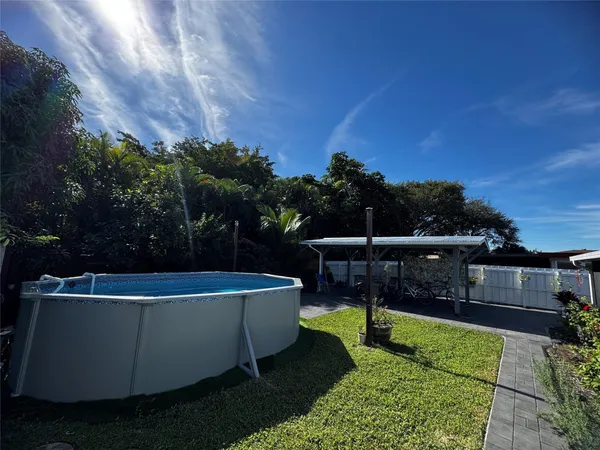 a view of a swimming pool with a patio