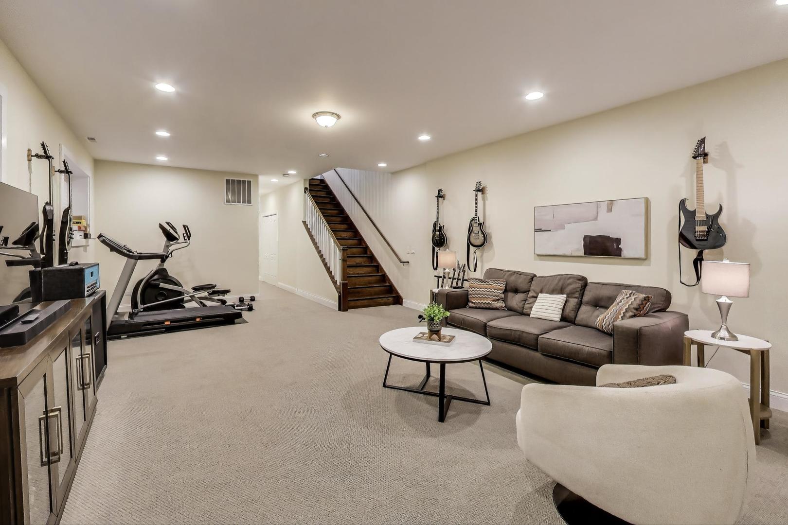 1045 West 34th Place Chicago, IL 60608 - Photo 25 of 35 a living room with furniture and a wooden floor