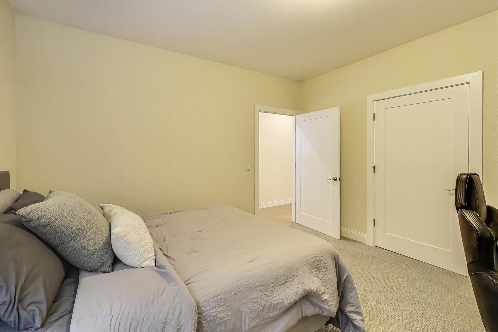 1045 West 34th Place Chicago, IL 60608 - Photo 27 of 35 a bedroom with a bed and furniture