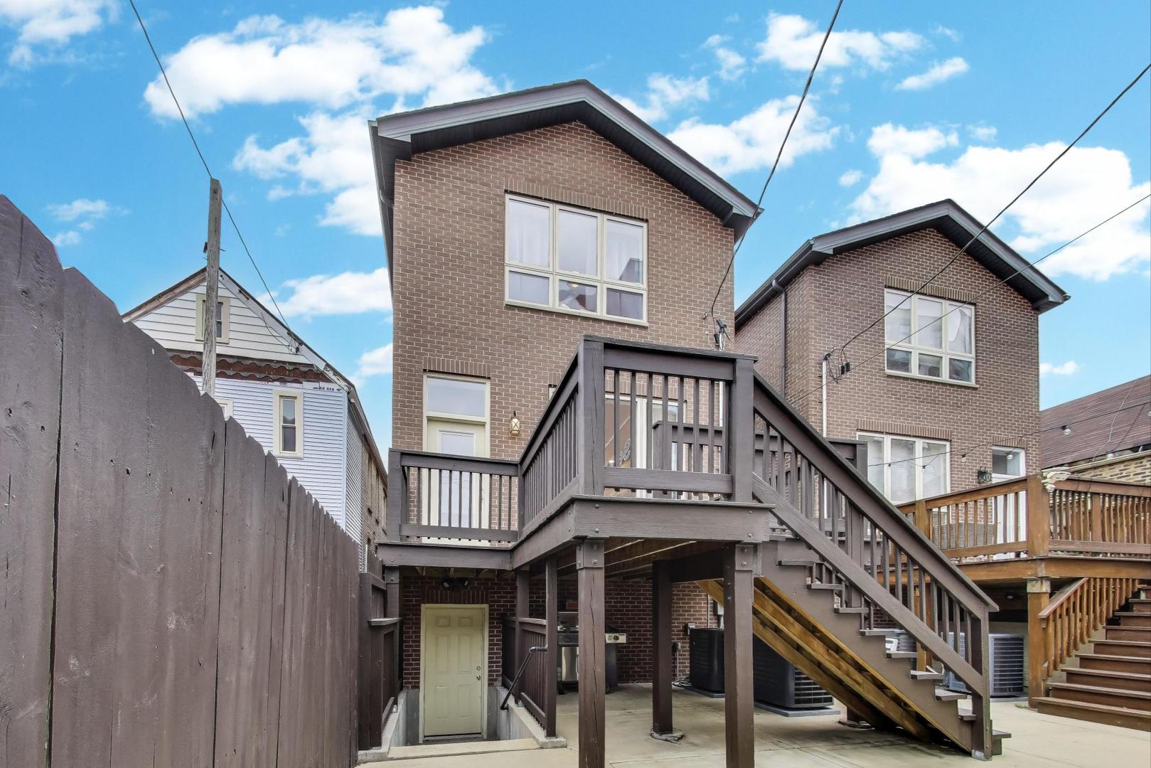 1045 West 34th Place Chicago, IL 60608 - Photo 32 of 35 a view of entryway and hall with wooden floor