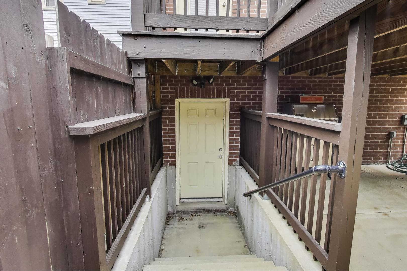 1045 West 34th Place Chicago, IL 60608 - Photo 34 of 35 a view of a house with wooden stairs