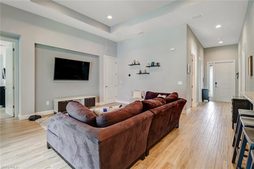 8476 Grove Road Fort Myers, FL 33967 - Photo 11 of 25 a living room with furniture and a flat screen tv