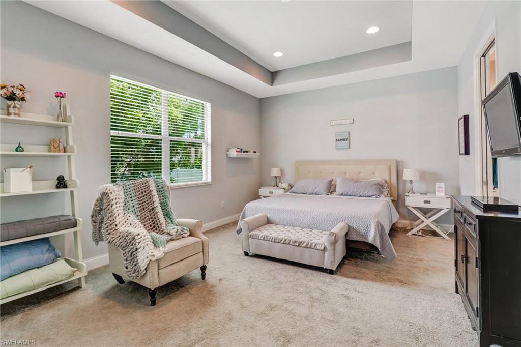 8476 Grove Road Fort Myers, FL 33967 - Photo 13 of 25 a bedroom with a bed and a couch