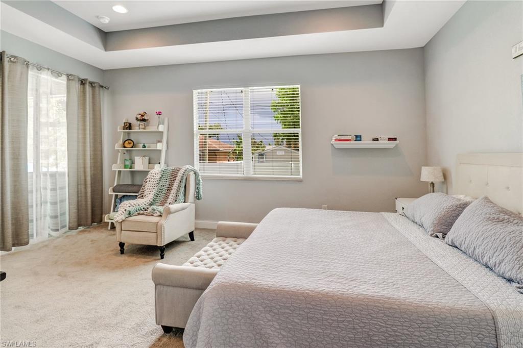 8476 Grove Road Fort Myers, FL 33967 - Photo 14 of 25 a bedroom with a bed and large window