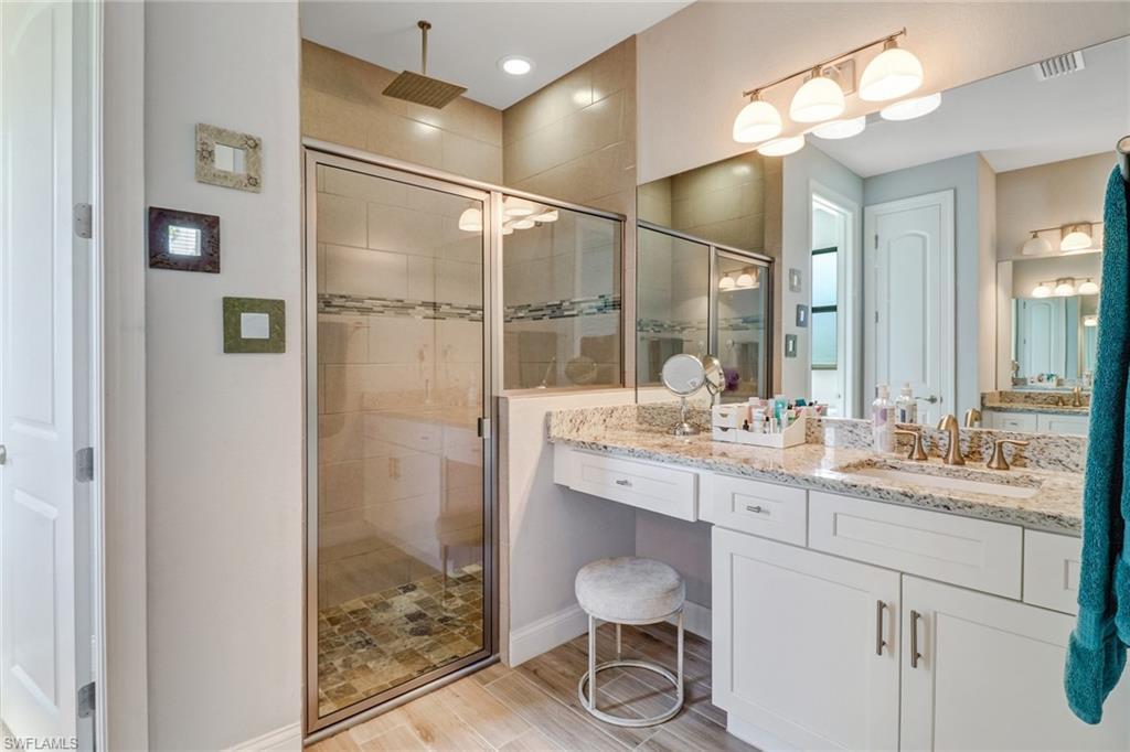 8476 Grove Road Fort Myers, FL 33967 - Photo 15 of 25 a bathroom with a sink and a mirror