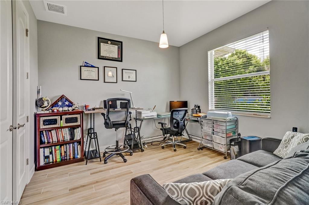 8476 Grove Road Fort Myers, FL 33967 - Photo 20 of 25 a view of a livingroom with workspace and a window