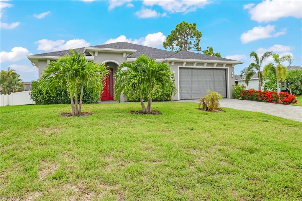 8476 Grove Road Fort Myers, FL 33967 - Photo 2 of 25 a view of a garden with a fountain