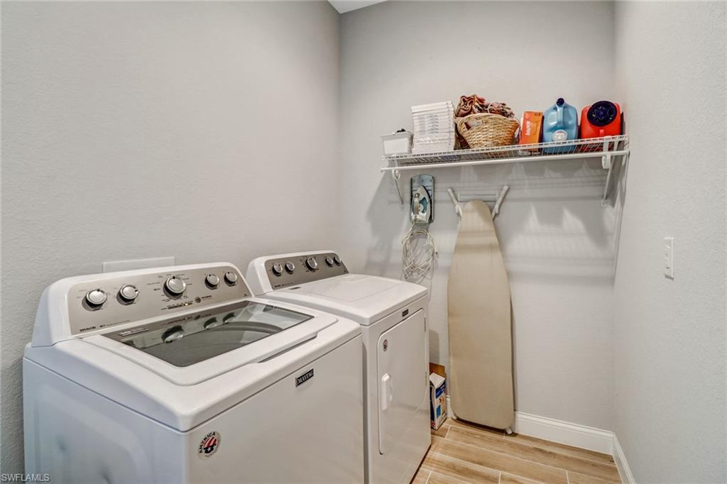 8476 Grove Road Fort Myers, FL 33967 - Photo 22 of 25 a utility room with dryer and washer