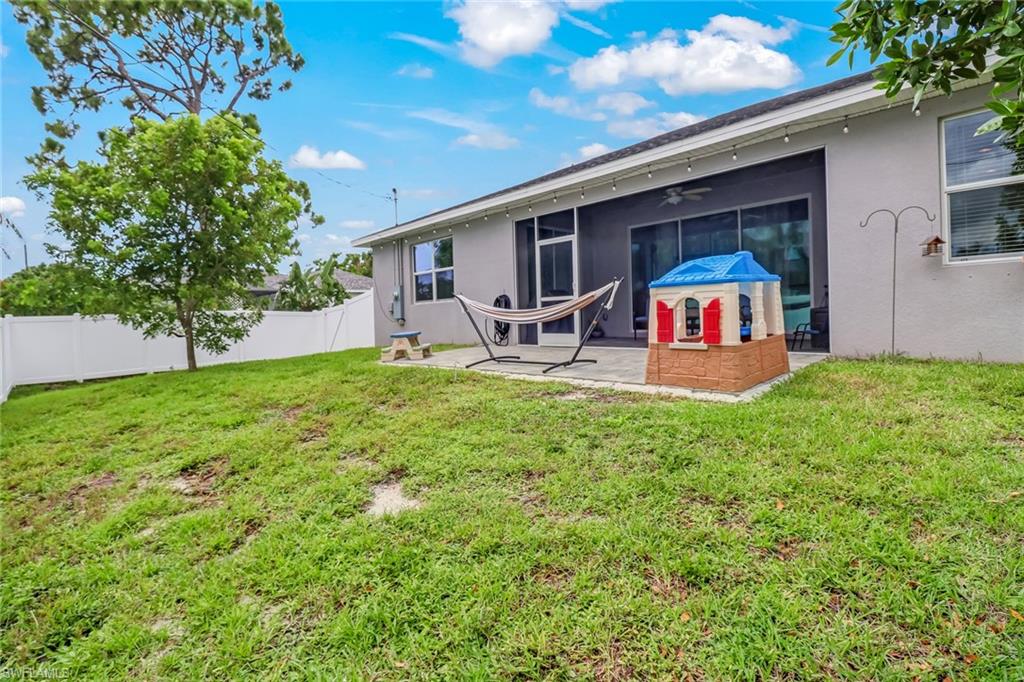 8476 Grove Road Fort Myers, FL 33967 - Photo 25 of 25 a view of a chairs and backyard of the house