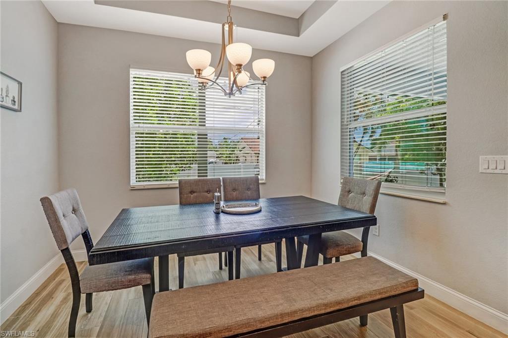 8476 Grove Road Fort Myers, FL 33967 - Photo 8 of 25 a view of a dining room with furniture window and outside view