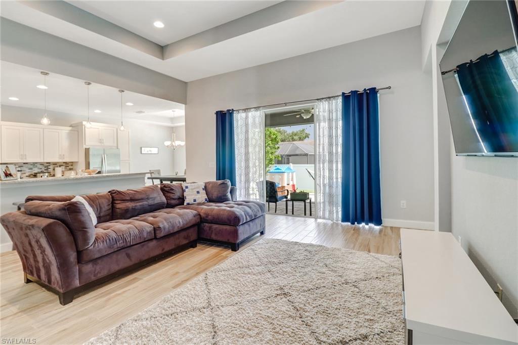 8476 Grove Road Fort Myers, FL 33967 - Photo 9 of 25 a view of a livingroom with furniture and a flat screen tv