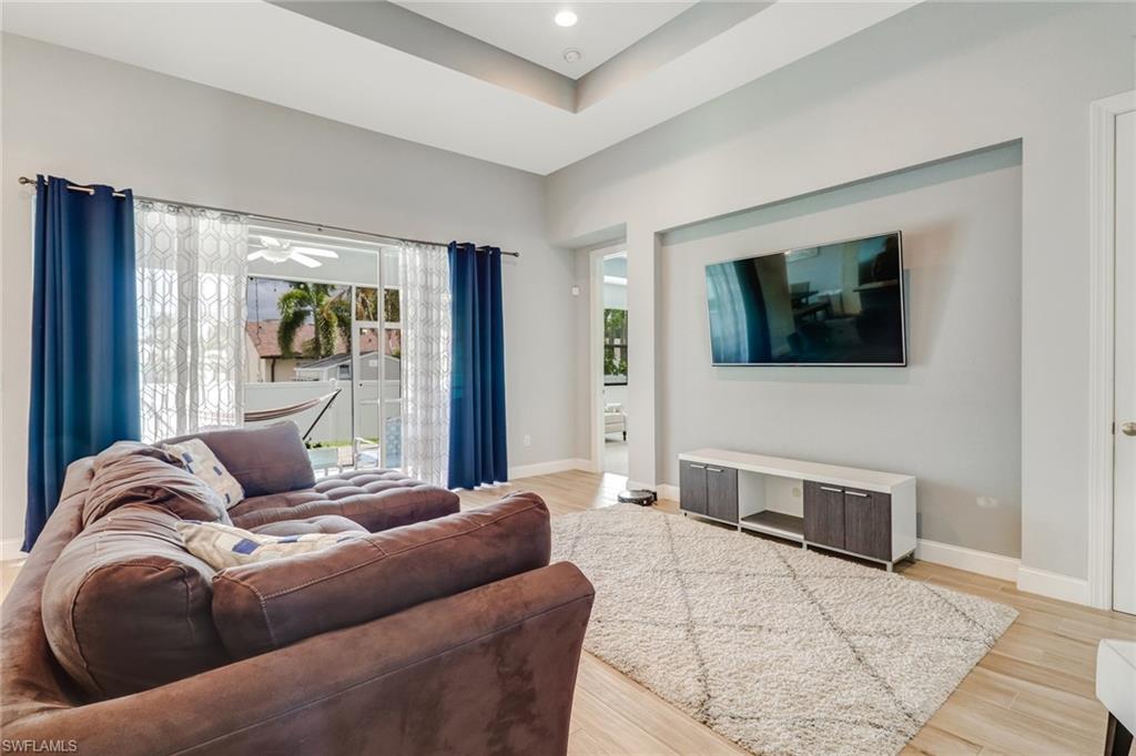 8476 Grove Road Fort Myers, FL 33967 - Photo 10 of 25 a living room with furniture and a flat screen tv
