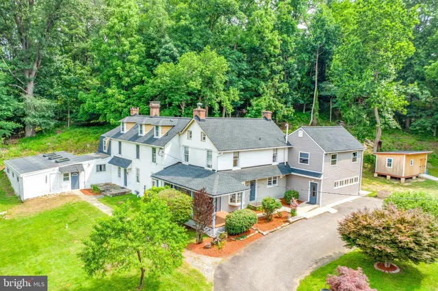 an aerial view of a house with a garden and plants