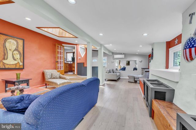 a bed room with furniture and a fireplace