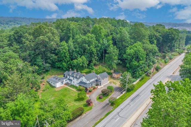 a view of a garden with a building in the background