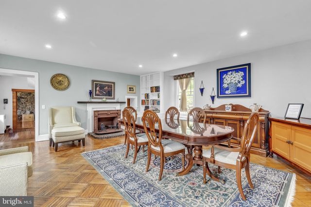 a view of a livingroom with furniture and a fireplace