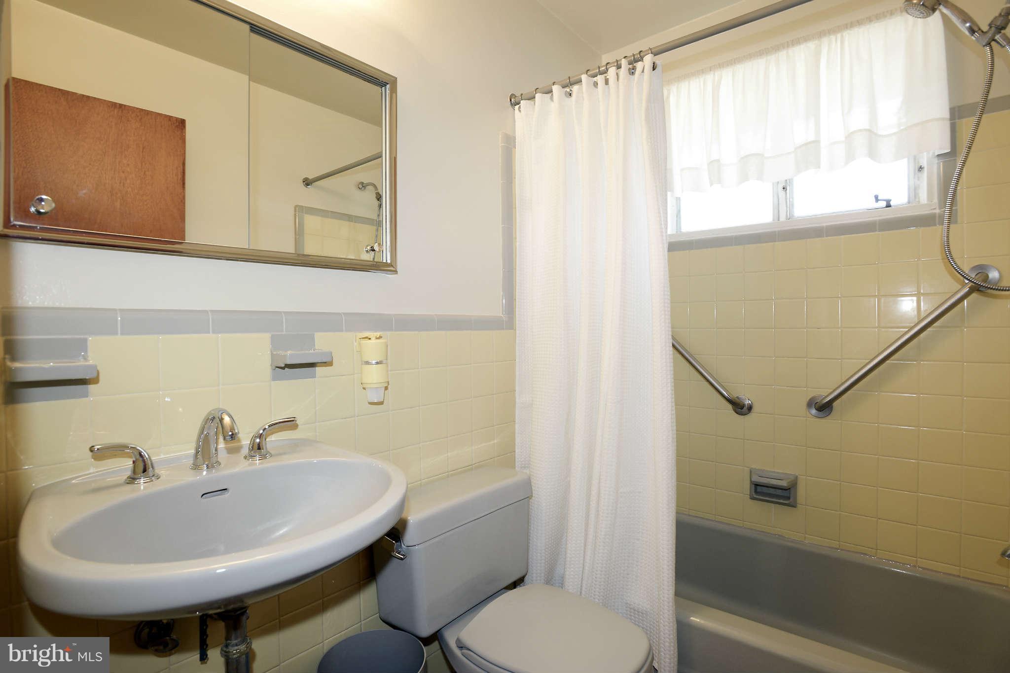 3913 Isbell Street Silver Spring, MD 20906 - Photo 13 of 23 a bathroom with a sink toilet and shower